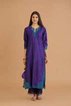 Blue hand crushed silk straight kurta set with silk and organza cutwork embroidery, highlighted with hand attached mirrors.