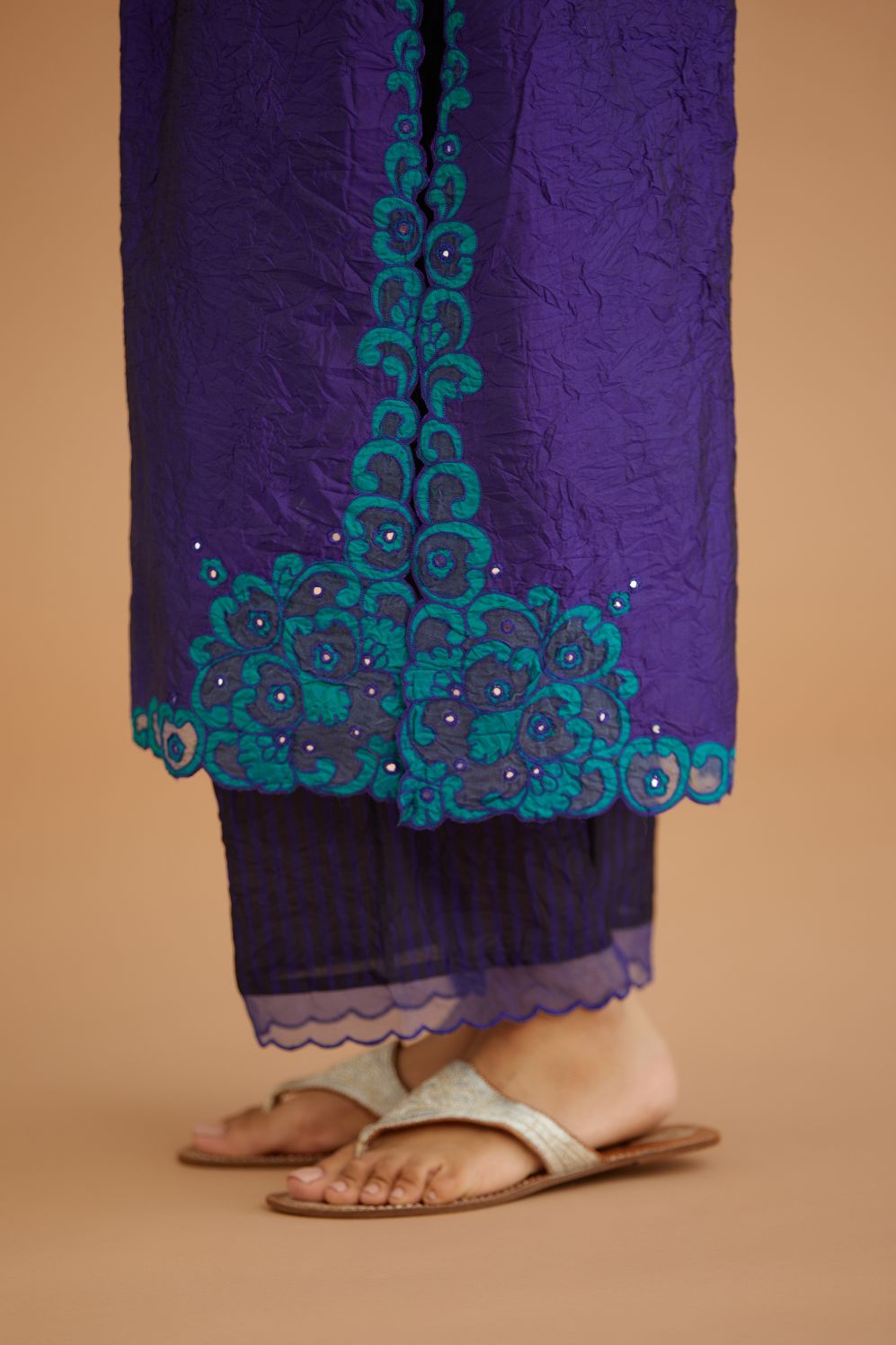 Blue hand crushed silk straight kurta set with silk and organza cutwork embroidery, highlighted with hand attached mirrors.