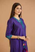 Blue hand crushed silk straight kurta set with silk and organza cutwork embroidery, highlighted with hand attached mirrors.