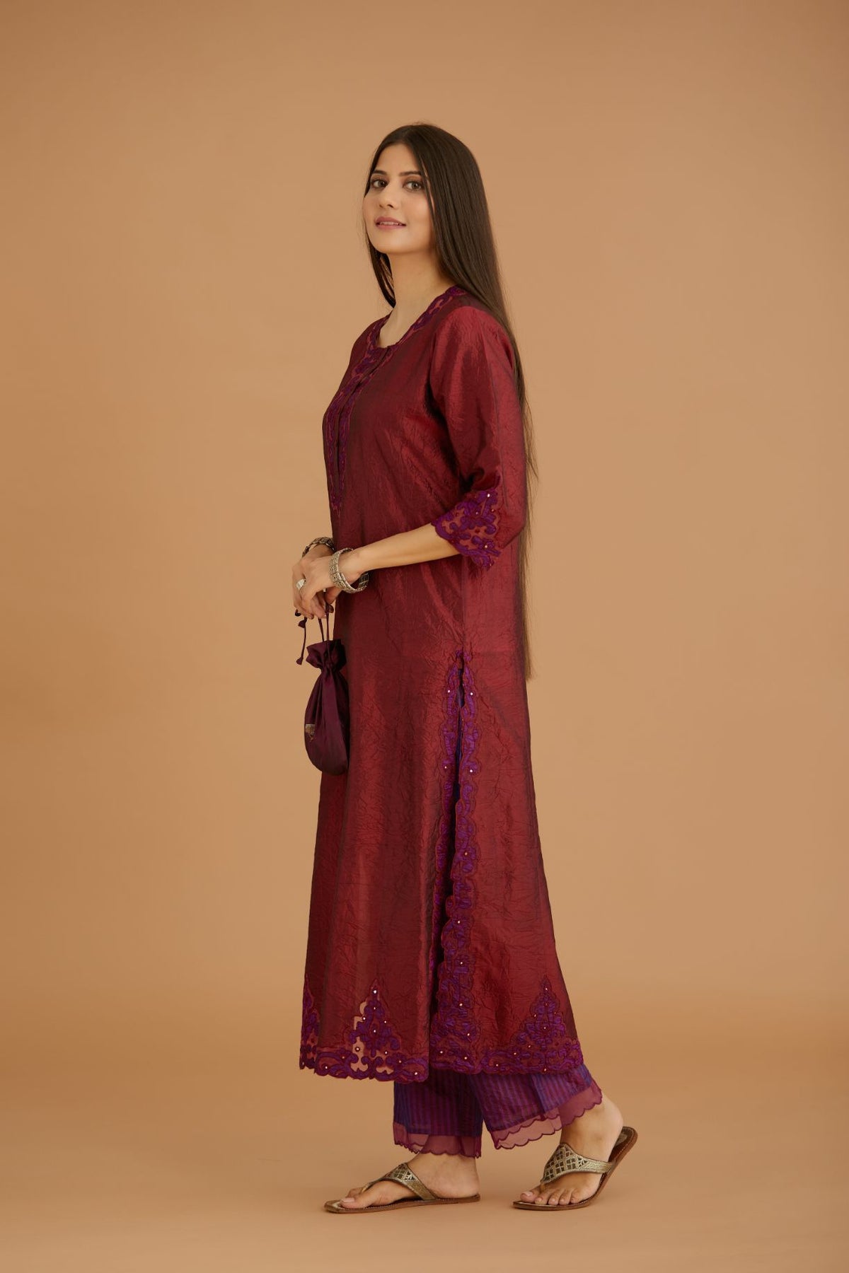 Maroon hand crushed silk straight kurta set with silk and organza cutwork embroidery, highlighted with hand attached mirrors.