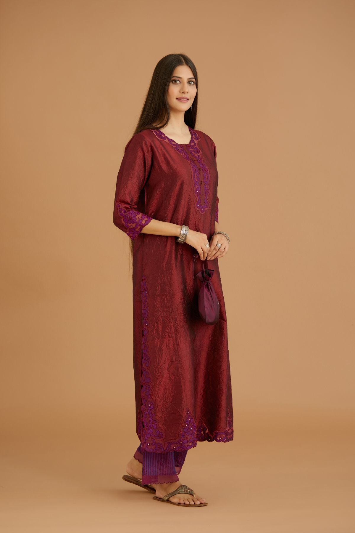 Maroon hand crushed silk straight kurta set with silk and organza cutwork embroidery, highlighted with hand attached mirrors.