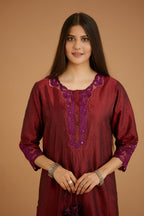 Maroon hand crushed silk straight kurta set with silk and organza cutwork embroidery, highlighted with hand attached mirrors.