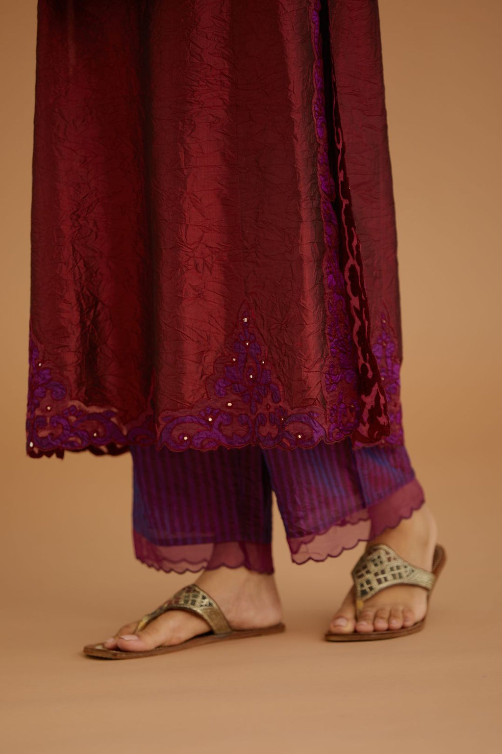 Maroon hand crushed silk straight kurta set with silk and organza cutwork embroidery, highlighted with hand attached mirrors.