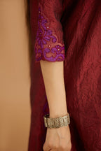 Maroon hand crushed silk straight kurta set with silk and organza cutwork embroidery, highlighted with hand attached mirrors.