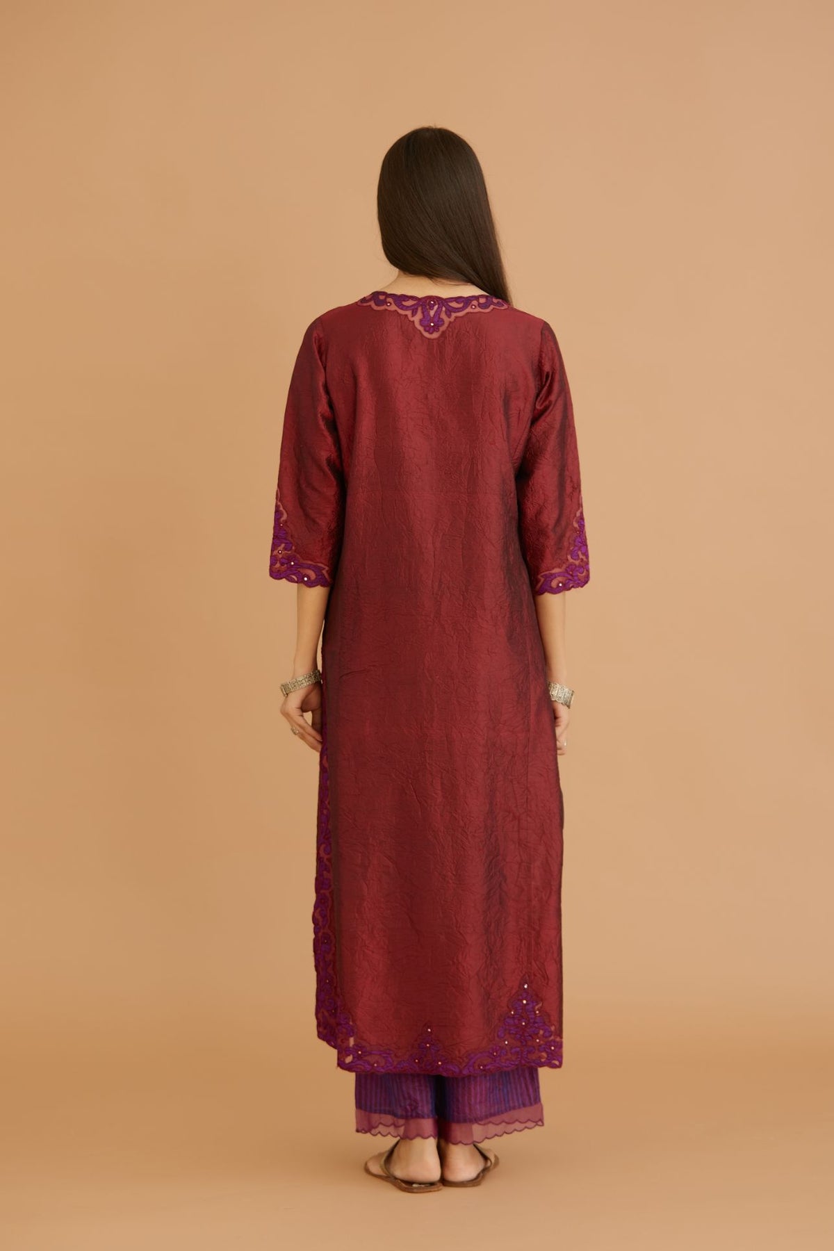 Maroon hand crushed silk straight kurta set with silk and organza cutwork embroidery, highlighted with hand attached mirrors.
