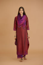 Maroon hand crushed silk straight kurta set with silk and organza cutwork embroidery, highlighted with hand attached mirrors.