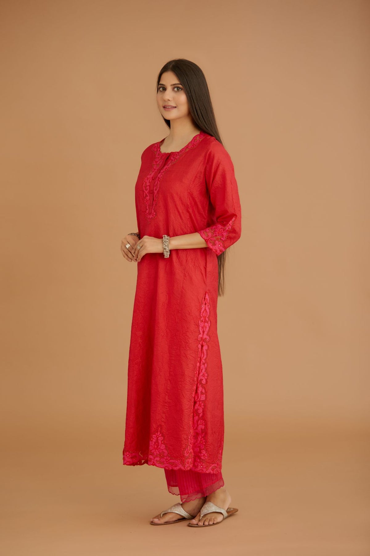Red hand crushed silk straight kurta set with silk and organza cutwork embroidery, highlighted with hand attached mirrors.