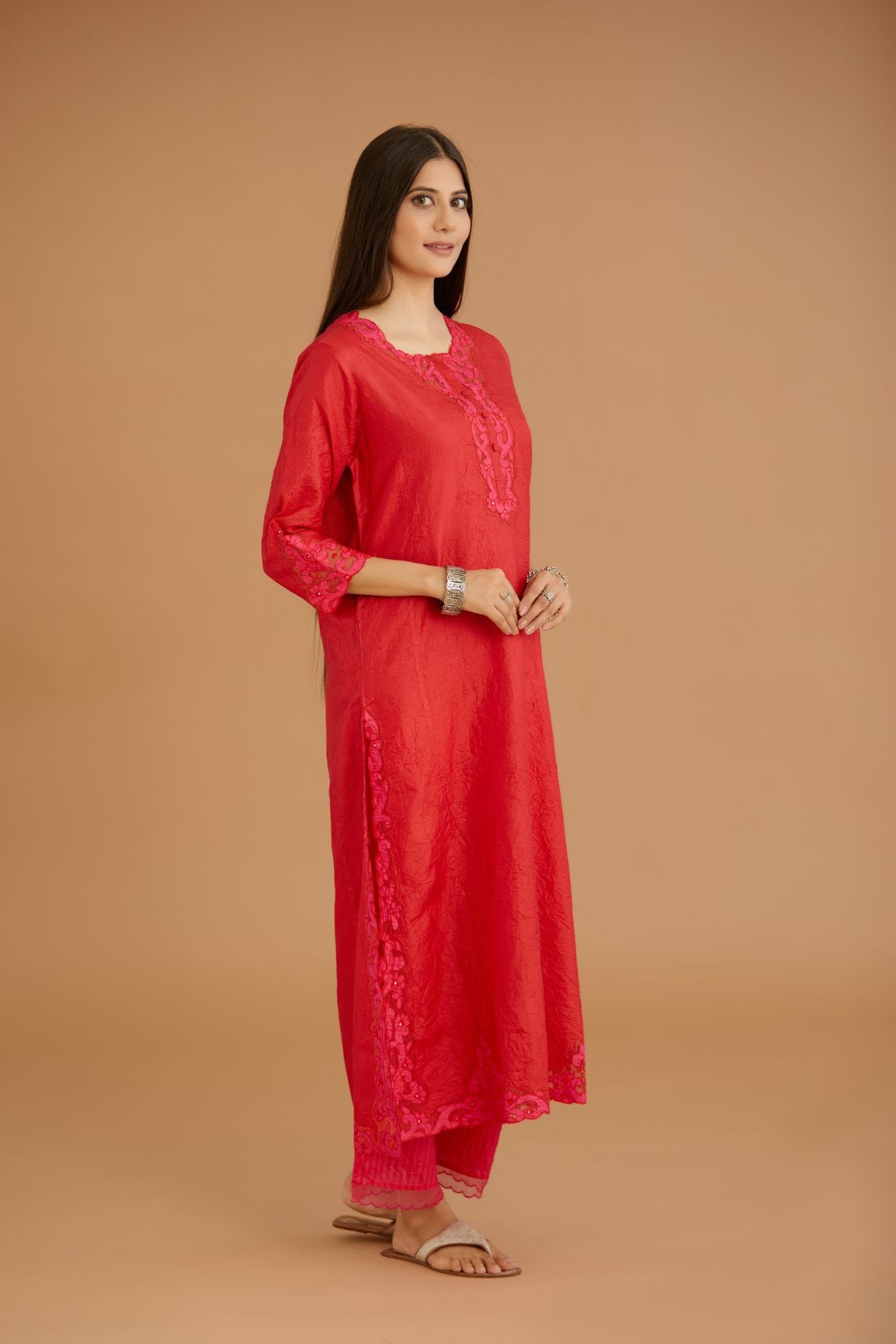 Red hand crushed silk straight kurta set with silk and organza cutwork embroidery, highlighted with hand attached mirrors.