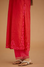 Red hand crushed silk straight kurta set with silk and organza cutwork embroidery, highlighted with hand attached mirrors.