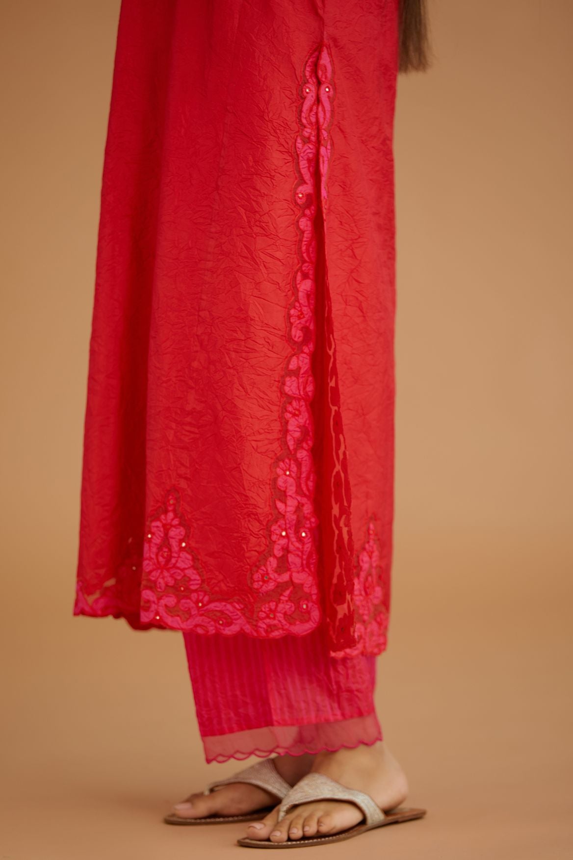 Red hand crushed silk straight kurta set with silk and organza cutwork embroidery, highlighted with hand attached mirrors.