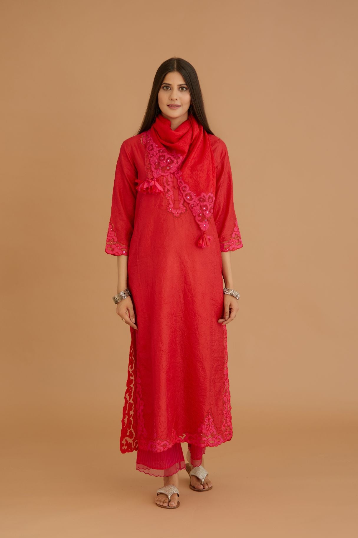 Red hand crushed silk straight kurta set with silk and organza cutwork embroidery, highlighted with hand attached mirrors.