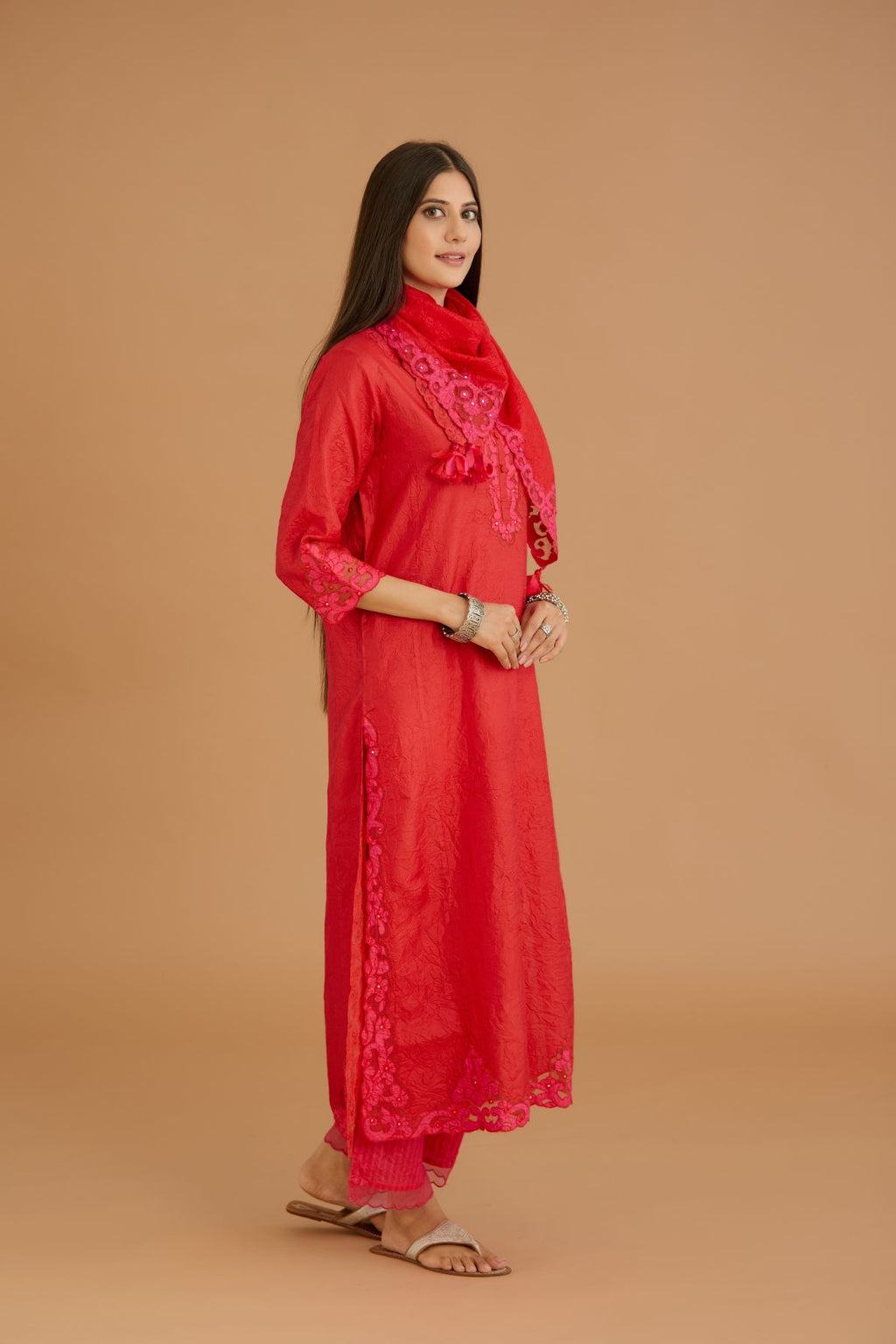 Red hand crushed silk straight kurta set with silk and organza cutwork embroidery, highlighted with hand attached mirrors.