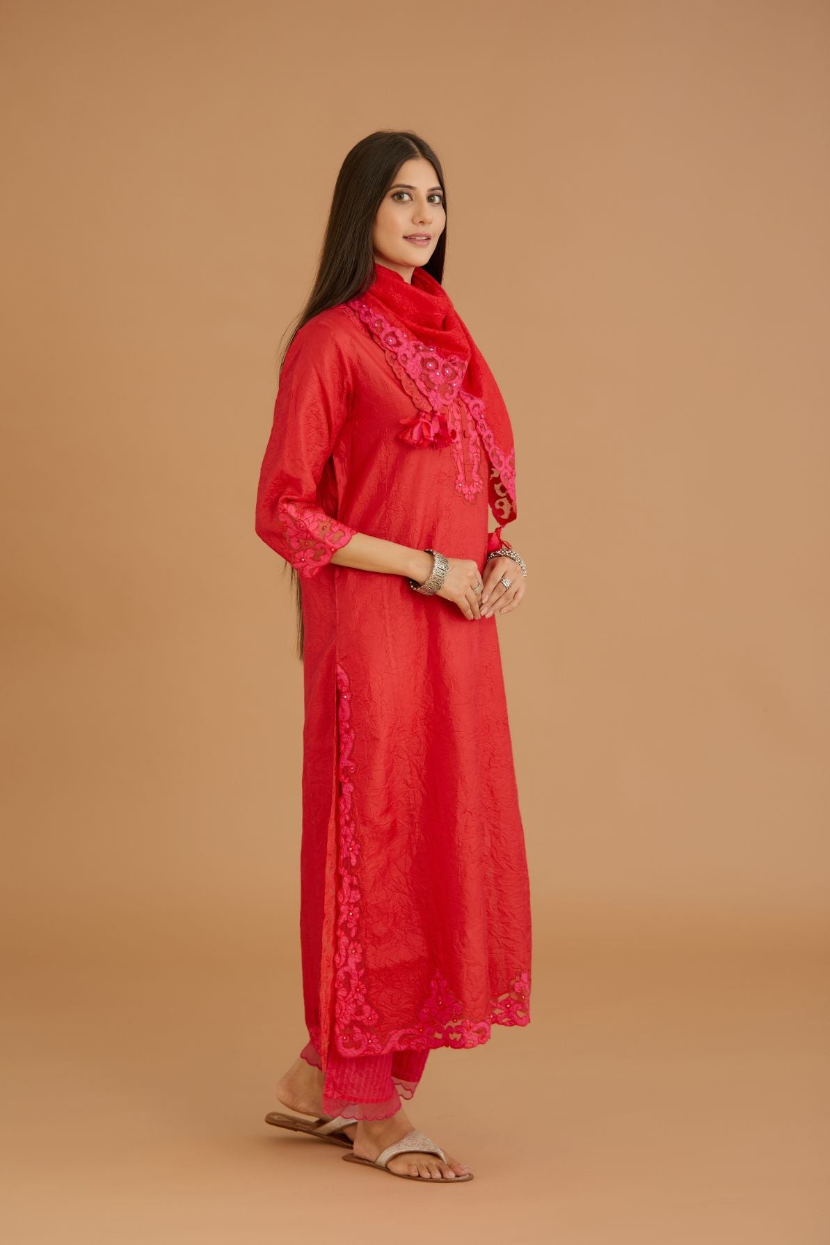 Red hand crushed silk straight kurta set with silk and organza cutwork embroidery, highlighted with hand attached mirrors.