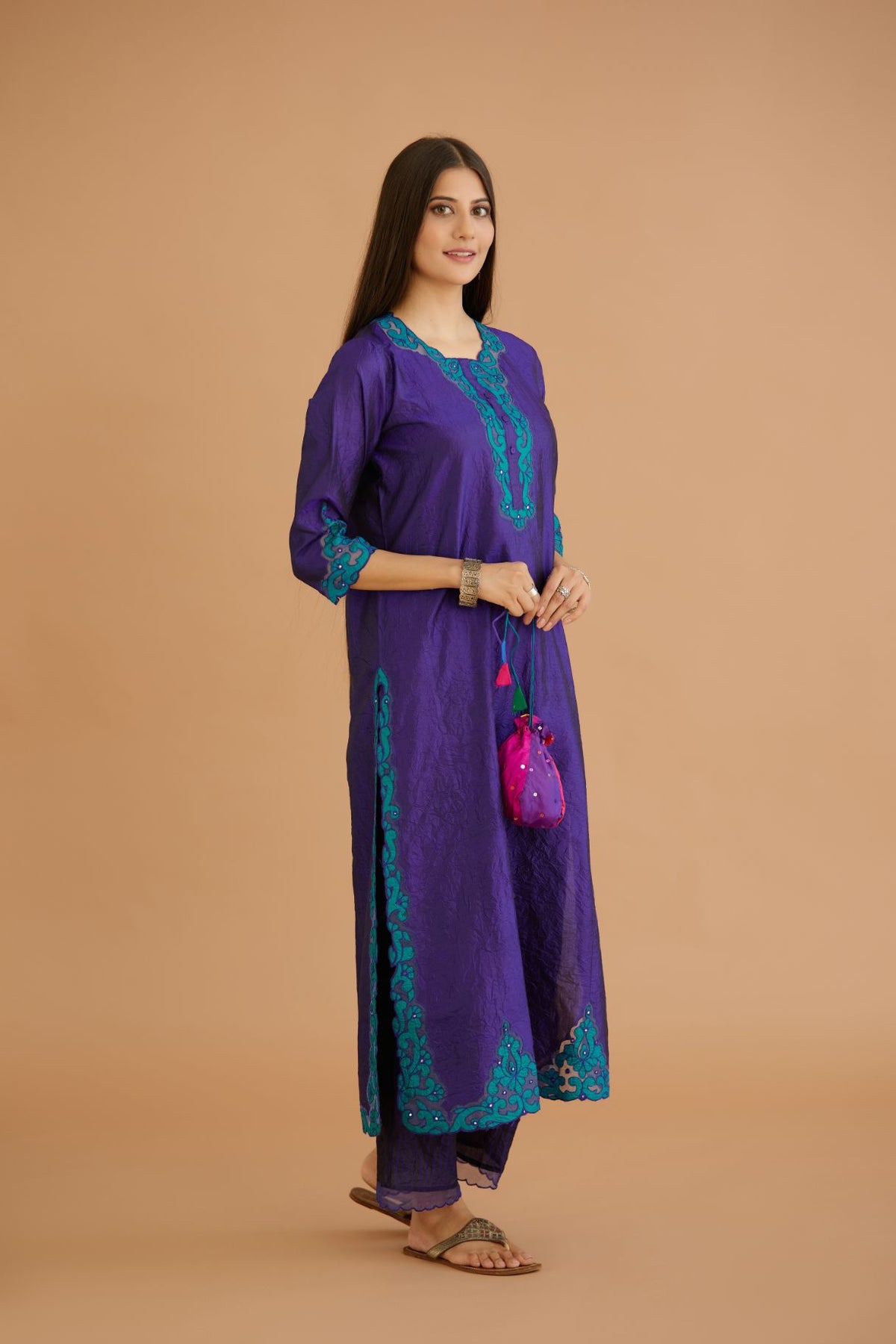 Blue hand crushed silk straight kurta set with silk and organza cutwork embroidery, highlighted with hand attached mirrors.