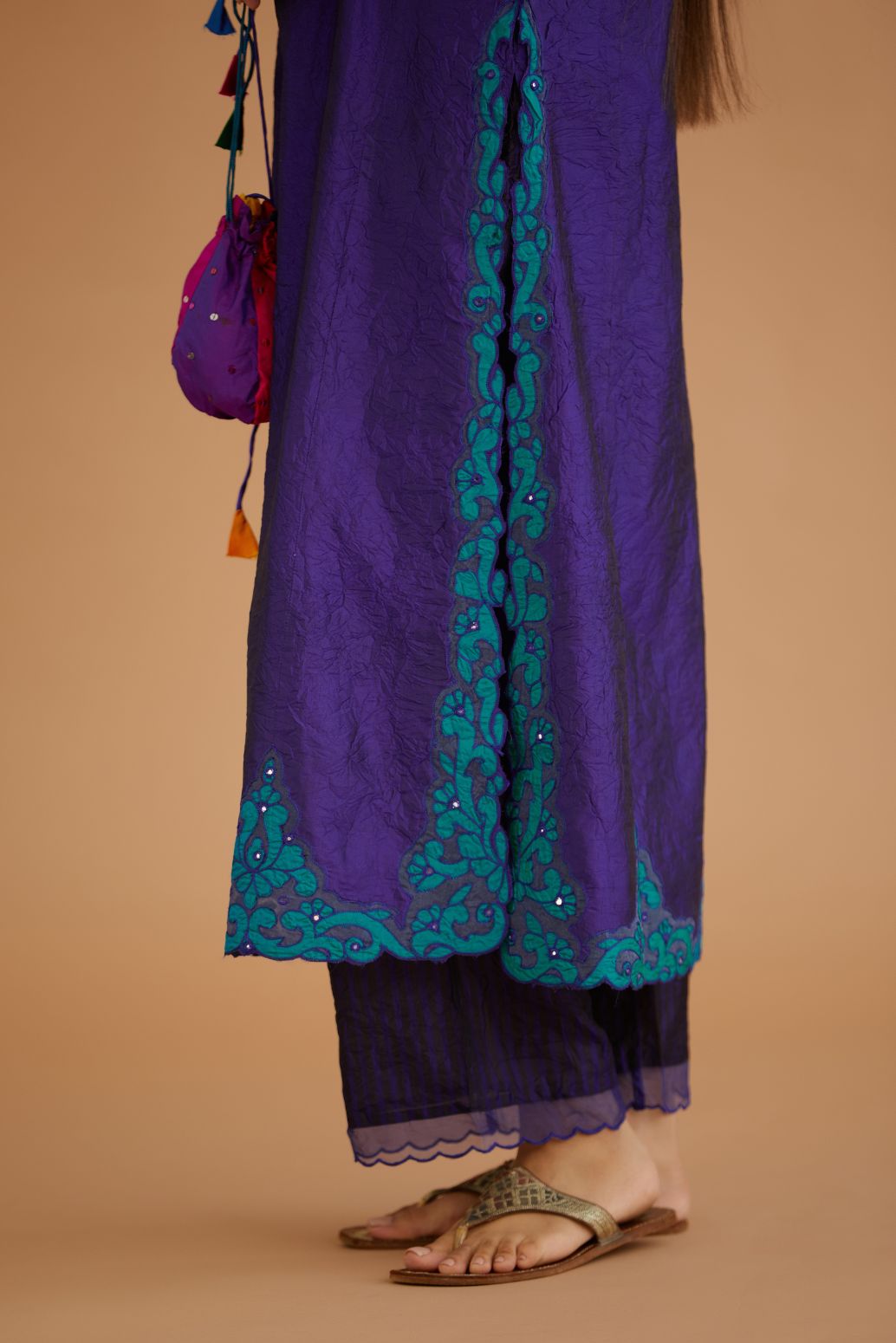 Blue hand crushed silk straight kurta set with silk and organza cutwork embroidery, highlighted with hand attached mirrors.