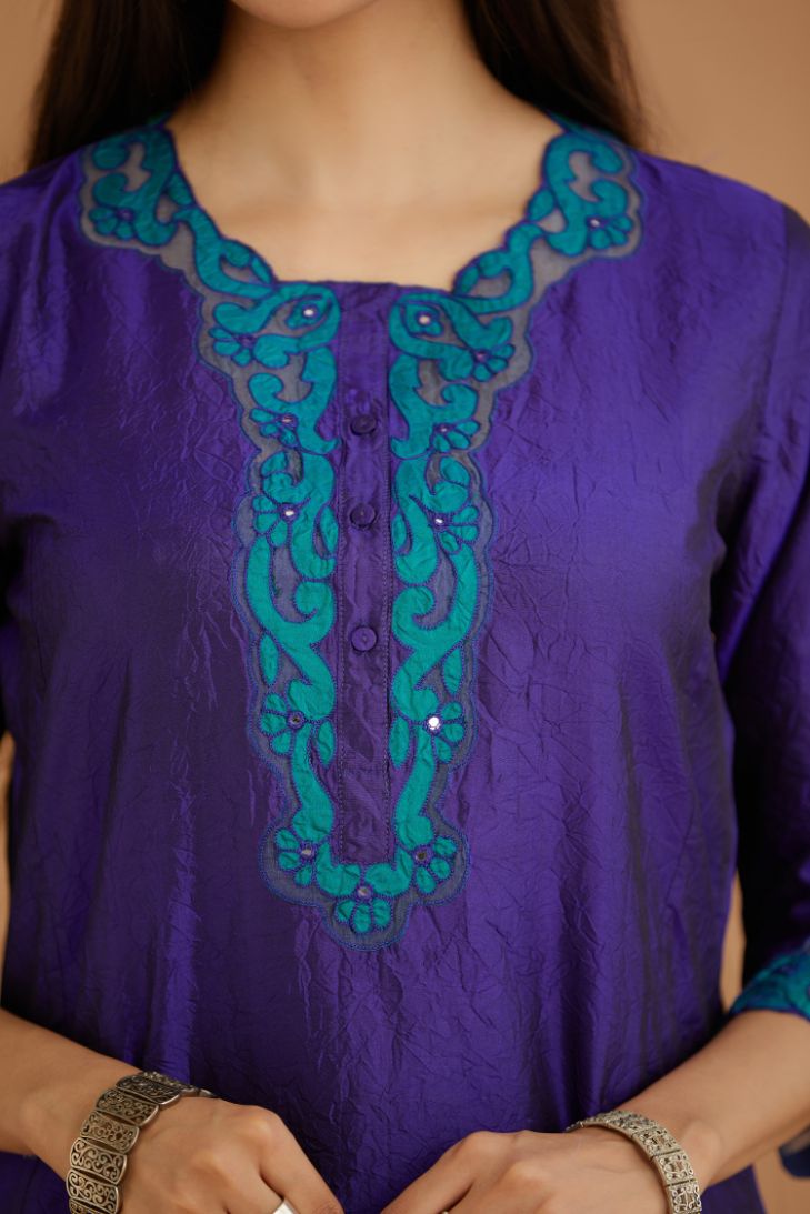 Blue hand crushed silk straight kurta set with silk and organza cutwork embroidery, highlighted with hand attached mirrors.