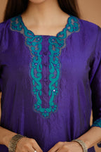 Blue hand crushed silk straight kurta set with silk and organza cutwork embroidery, highlighted with hand attached mirrors.