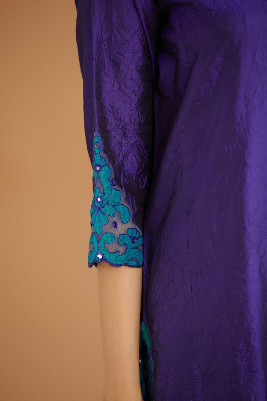 Blue hand crushed silk straight kurta set with silk and organza cutwork embroidery, highlighted with hand attached mirrors.