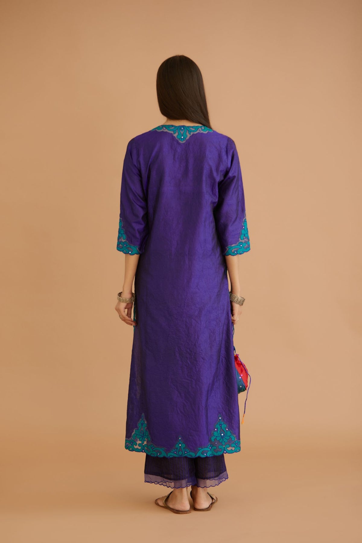 Blue hand crushed silk straight kurta set with silk and organza cutwork embroidery, highlighted with hand attached mirrors.
