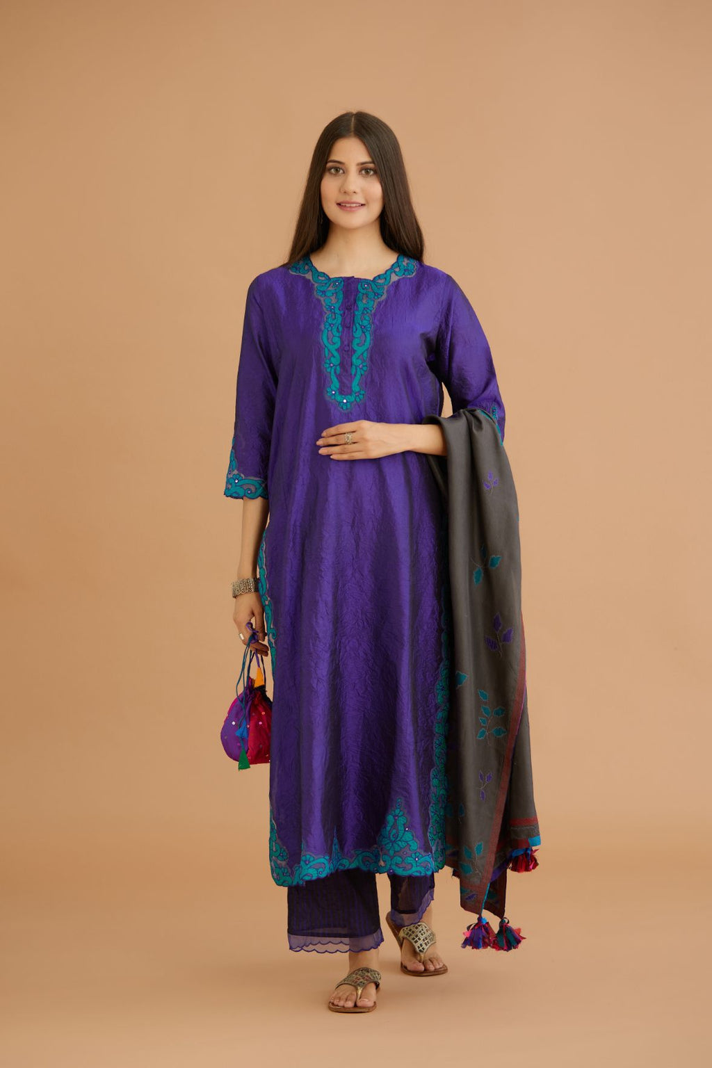 Blue hand crushed silk straight kurta set with silk and organza cutwork embroidery, highlighted with hand attached mirrors.