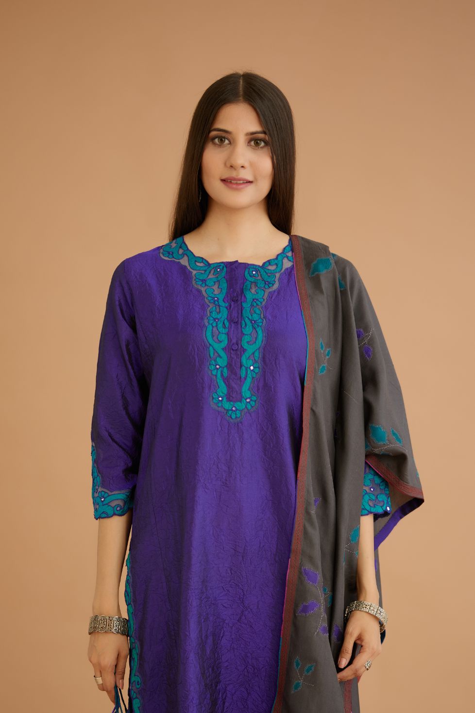 Blue hand crushed silk straight kurta set with silk and organza cutwork embroidery, highlighted with hand attached mirrors.