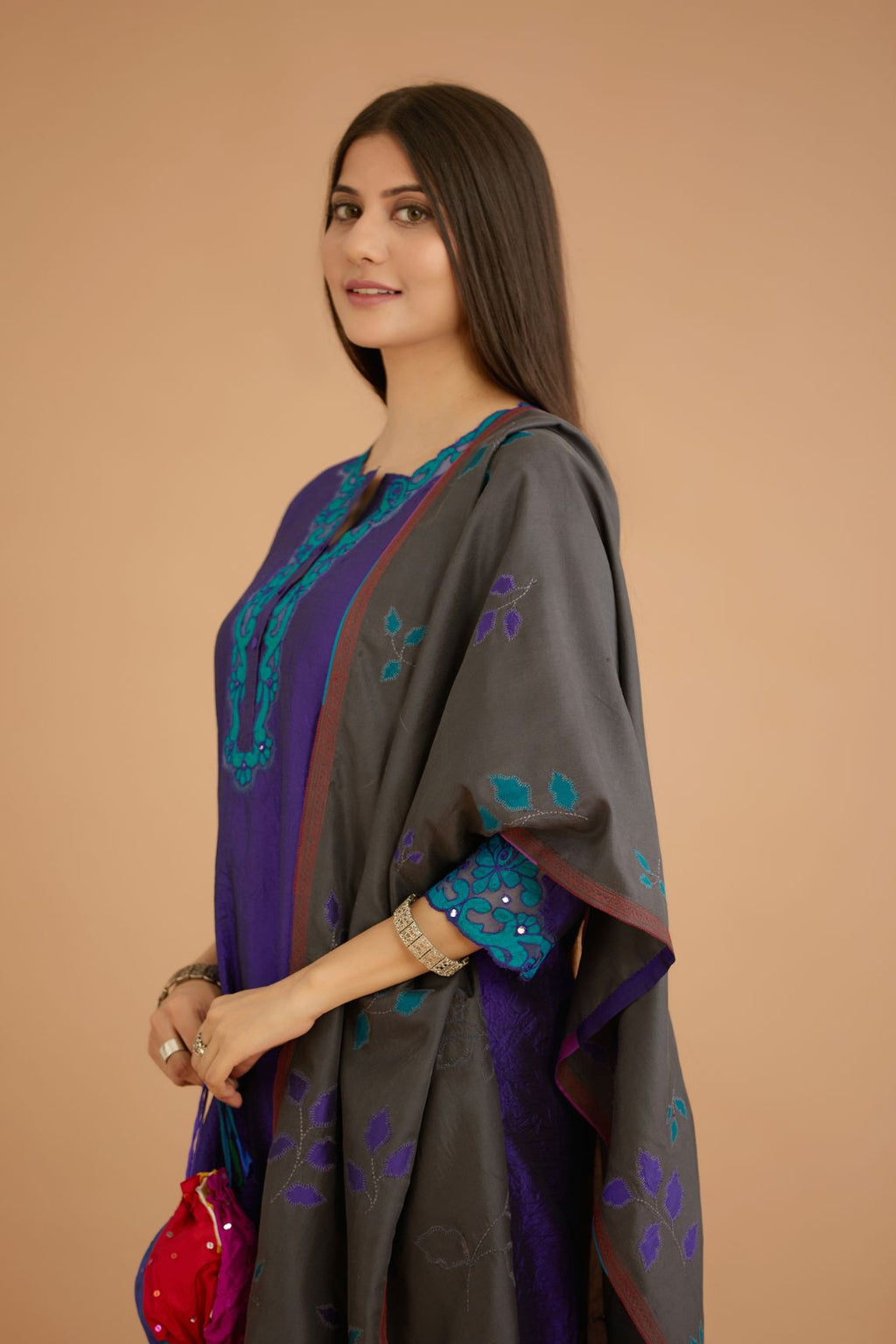 Blue hand crushed silk straight kurta set with silk and organza cutwork embroidery, highlighted with hand attached mirrors.