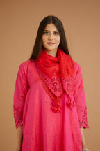 Fuchsia hand crushed silk kurta set with cutwork embroidered asymmetric hem, highlighted with hand attached mirrors.
