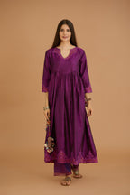 Purple hand crushed silk kurta set with wavy empire waistline and gathers, with silk and organza cutwork embroidery, highlighted with hand attached mirrors.
