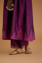 Purple hand crushed silk kurta set with wavy empire waistline and gathers, with silk and organza cutwork embroidery, highlighted with hand attached mirrors.