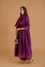Purple hand crushed silk kurta set with wavy empire waistline and gathers, with silk and organza cutwork embroidery, highlighted with hand attached mirrors.