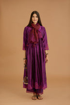 Purple hand crushed silk kurta set with wavy empire waistline and gathers, with silk and organza cutwork embroidery, highlighted with hand attached mirrors.