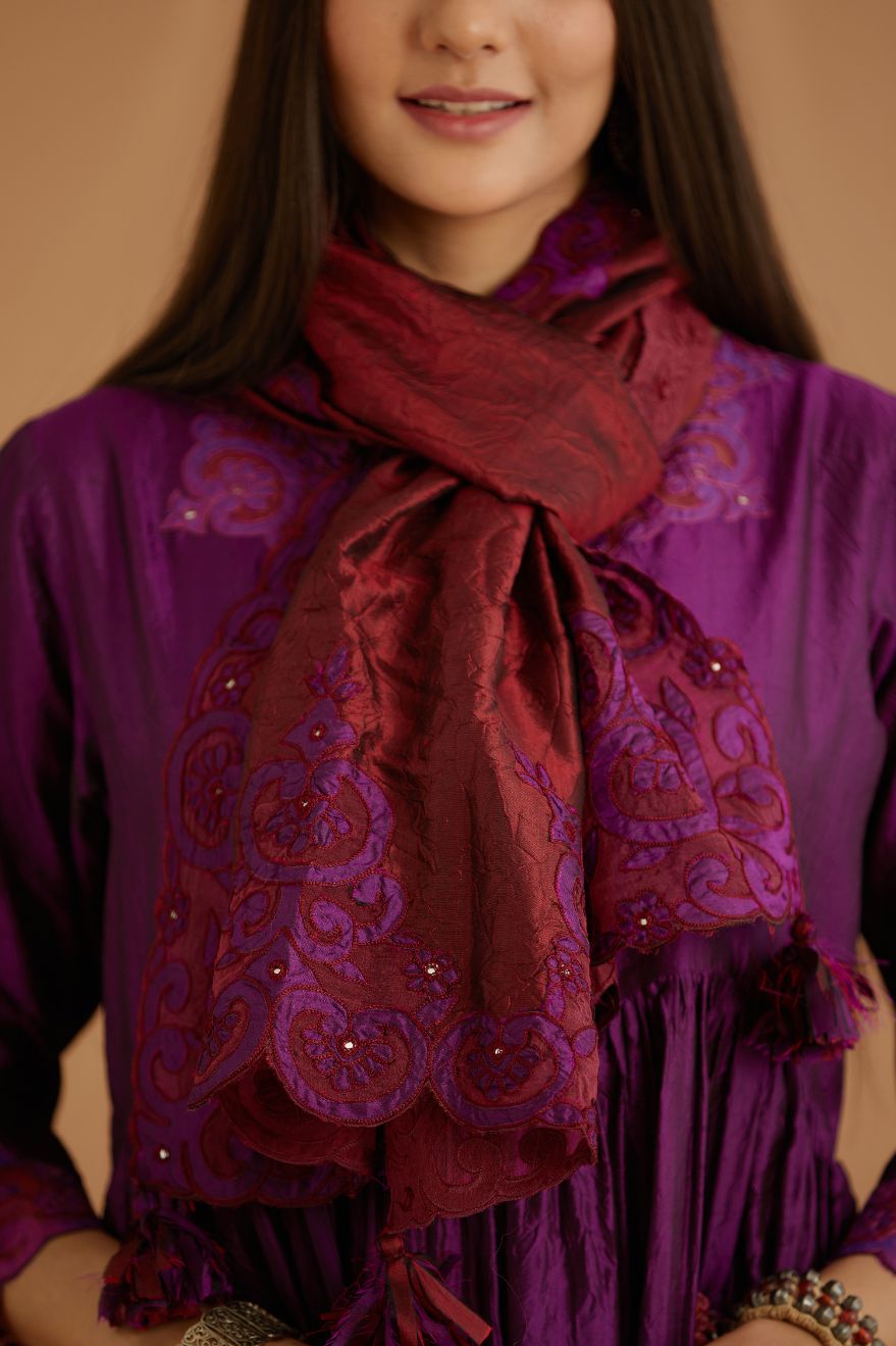 Purple hand crushed silk kurta set with wavy empire waistline and gathers, with silk and organza cutwork embroidery, highlighted with hand attached mirrors.