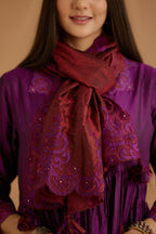 Purple hand crushed silk kurta set with wavy empire waistline and gathers, with silk and organza cutwork embroidery, highlighted with hand attached mirrors.