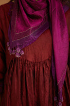 Maroon hand crushed silk kurta set with wavy empire waistline and gathers, with silk and organza cutwork embroidery, highlighted with hand attached mirrors.