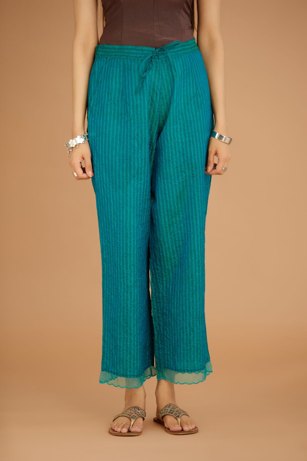 Teal Blue hand crushed silk pants with hand block print fine stripes and organza fabric and embroidery detail at bottom hem.