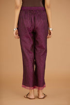 Dark Purple hand crushed silk pants with hand block print fine stripes and organza fabric and embroidery detail at bottom hem.