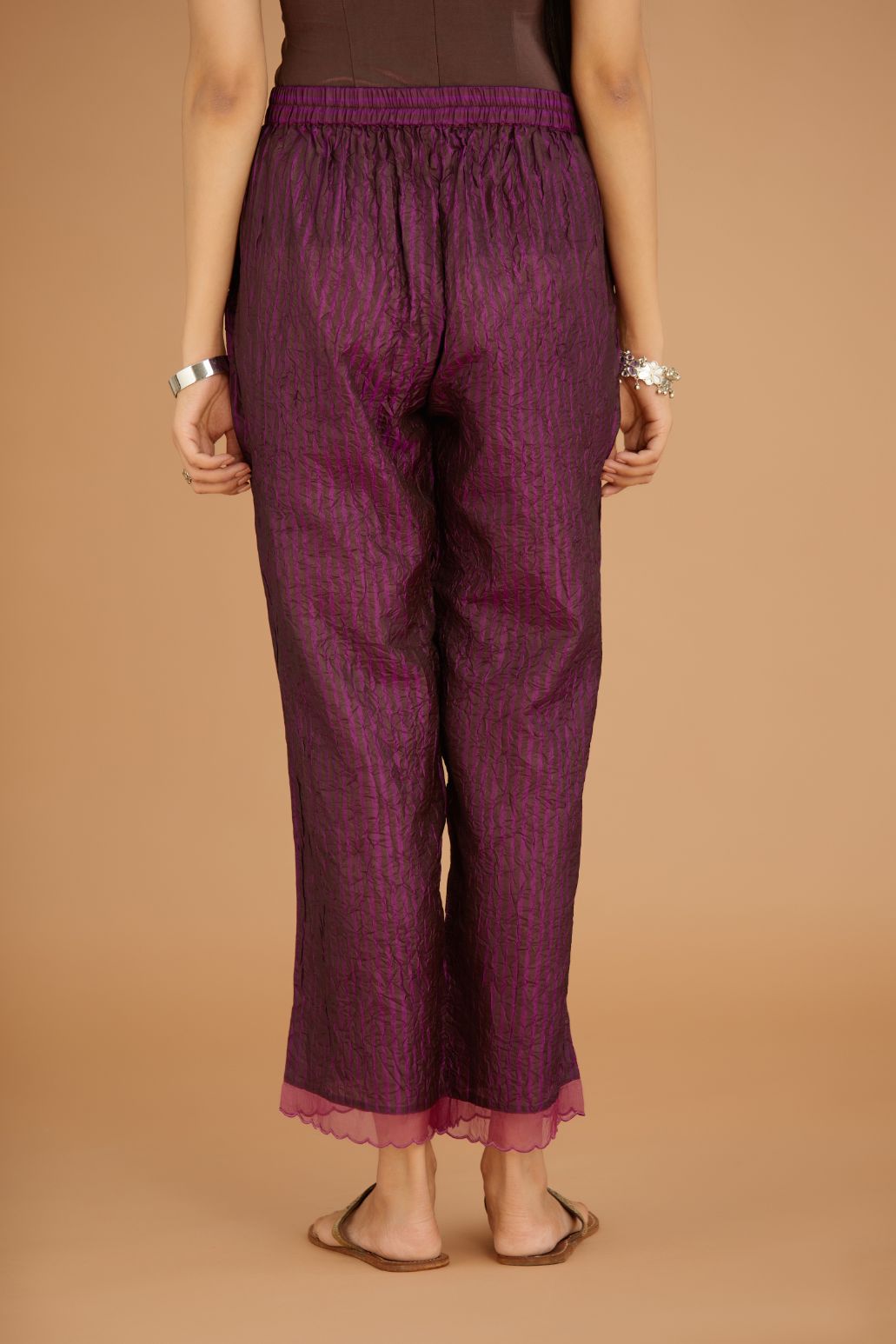 Dark Purple hand crushed silk pants with hand block print fine stripes and organza fabric and embroidery detail at bottom hem.