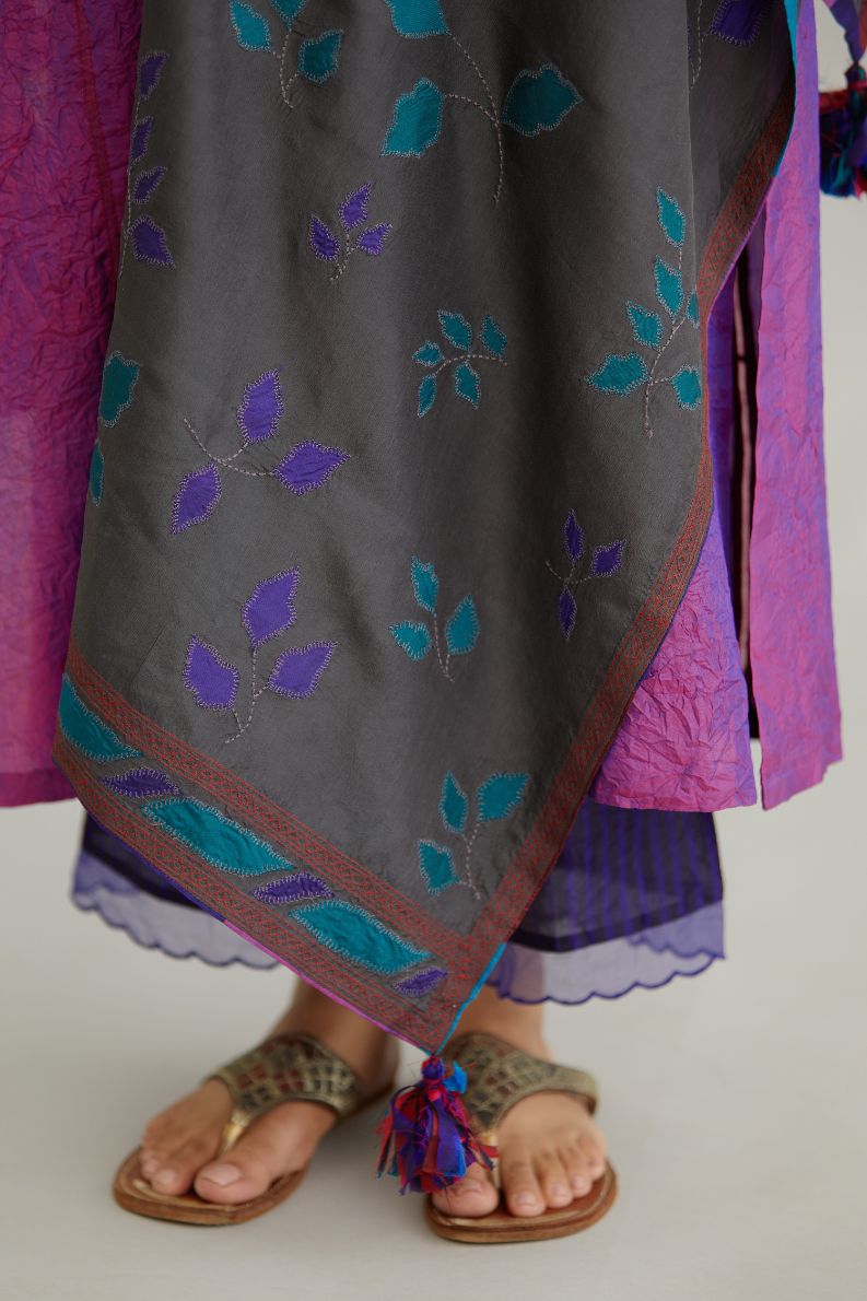 Grey hand crushed silk stole with silk fabric applique work and embroidery at edges.