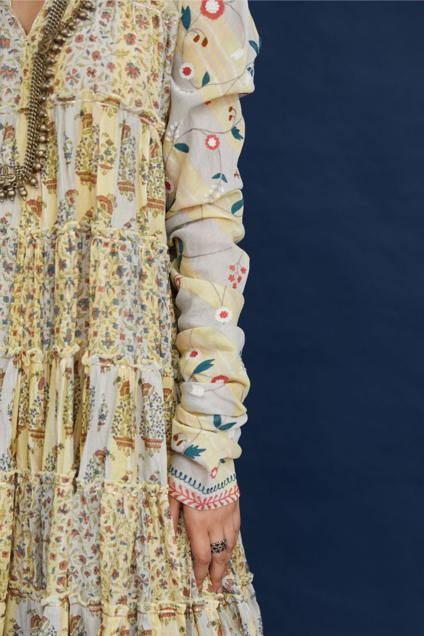 Hand block printed multi-tiered kurta dress set with churi sleeves and multi thread embroidery detailing.