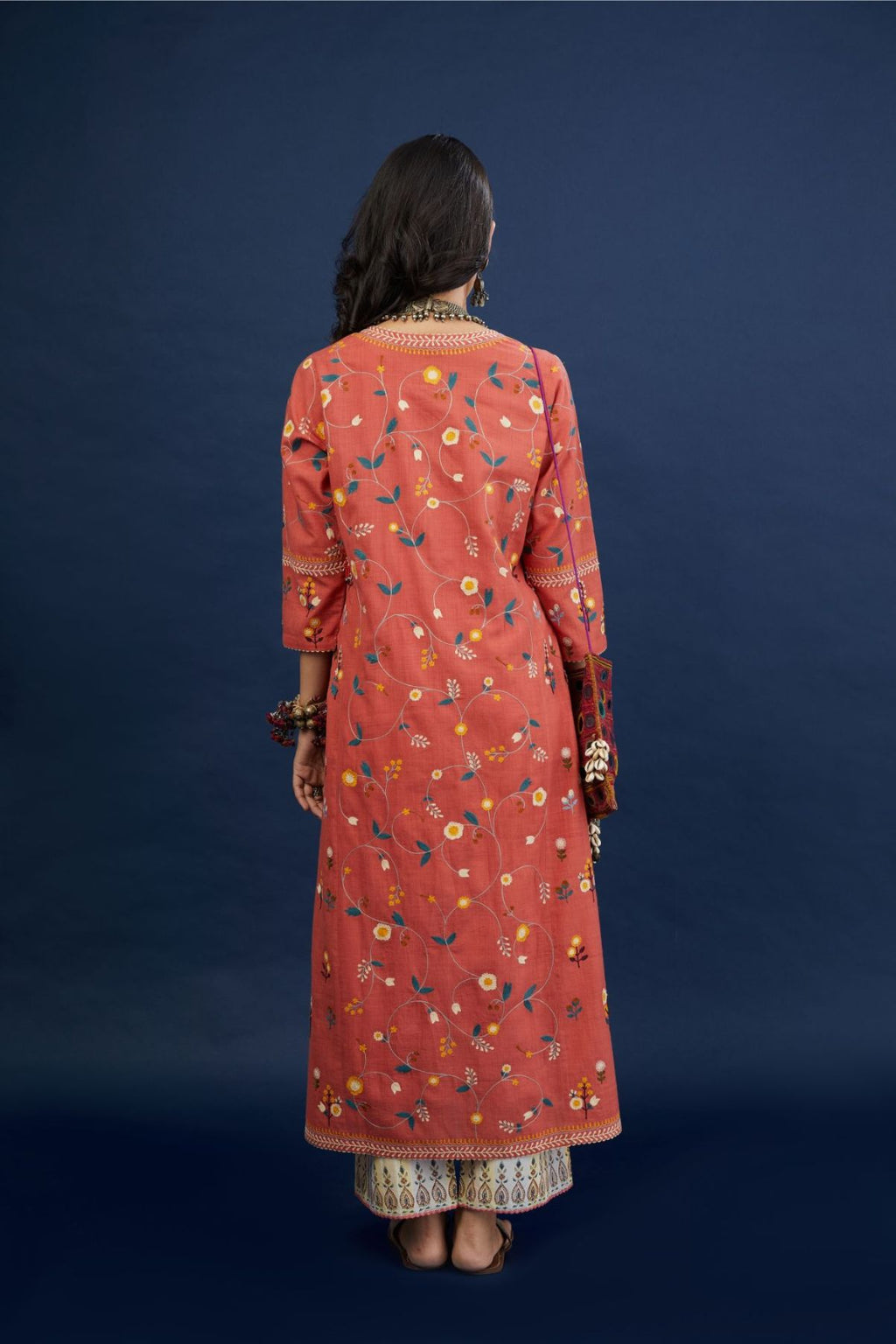 Brick red handspun  hand-woven cotton kurta set with all-over multi thread jaal embroidery .