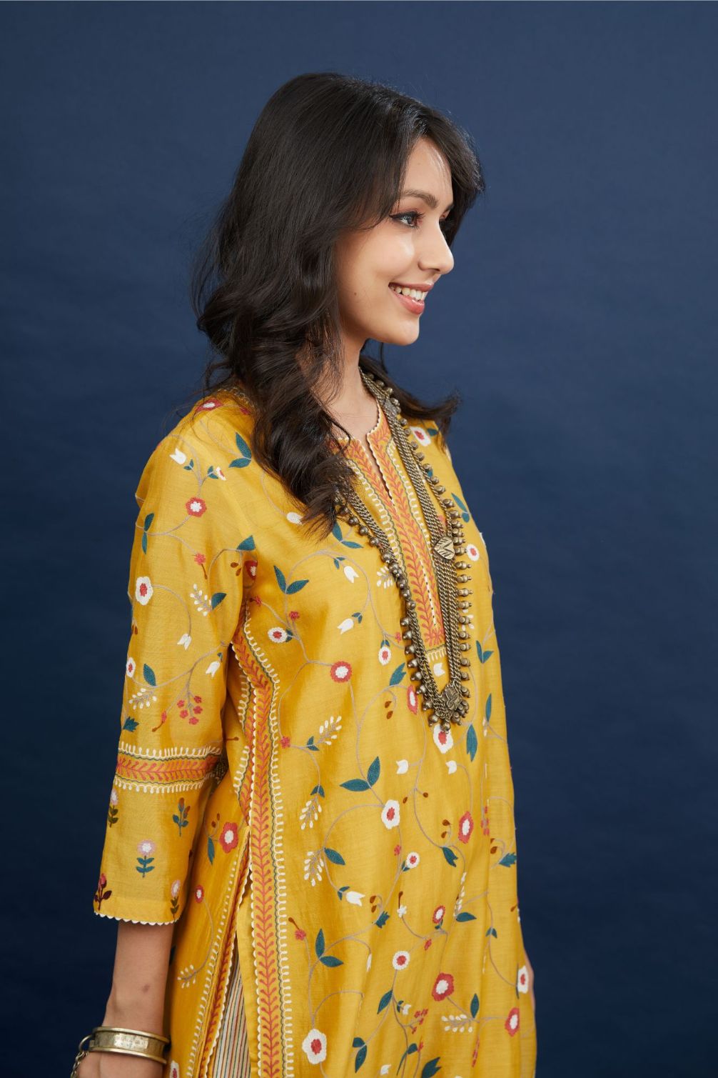 Silk chanderi straigh kurta set with all-over multi thread jaal embroidery and non functional tying cord at sides.