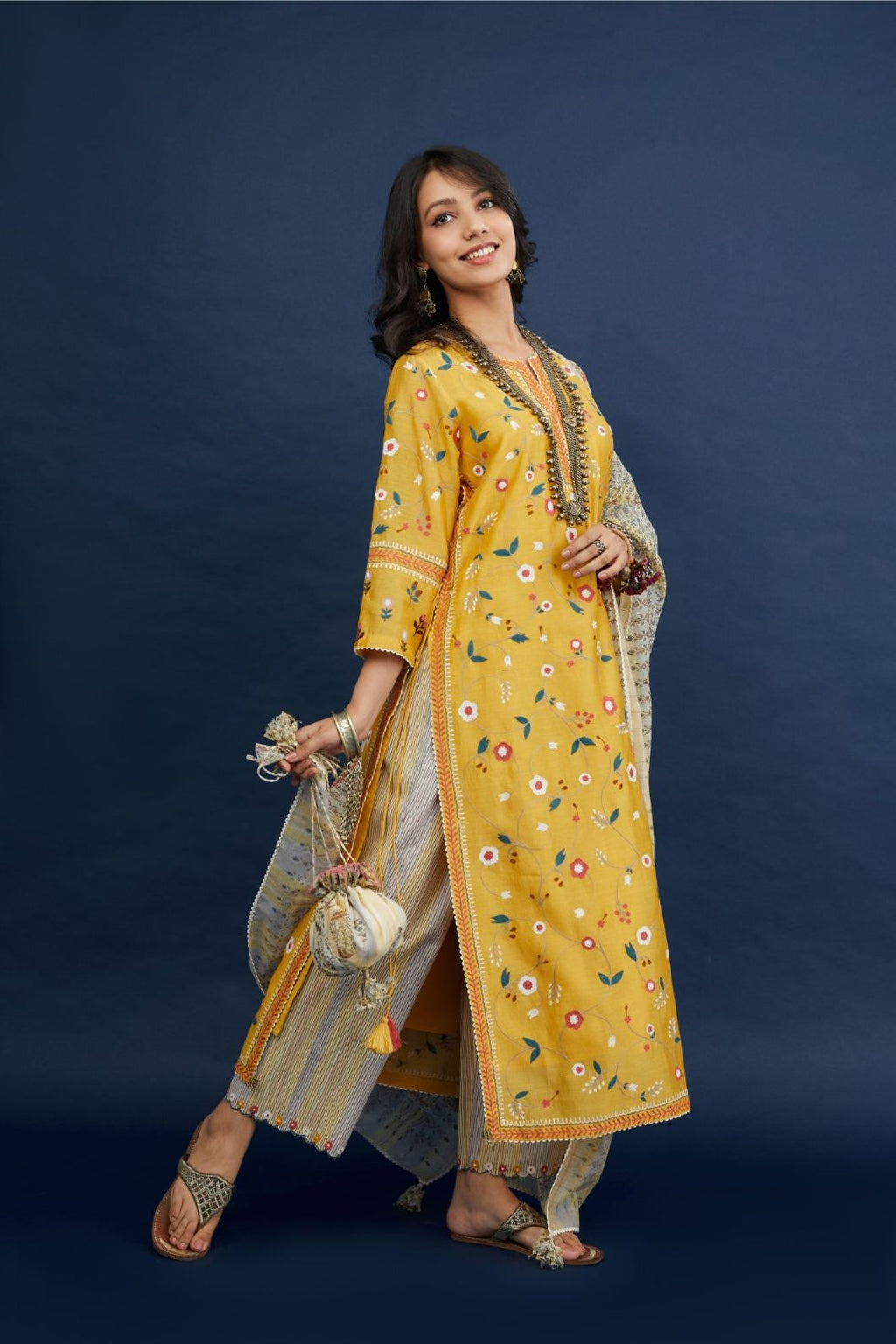 Silk chanderi straigh kurta set with all-over multi thread jaal embroidery and non functional tying cord at sides.