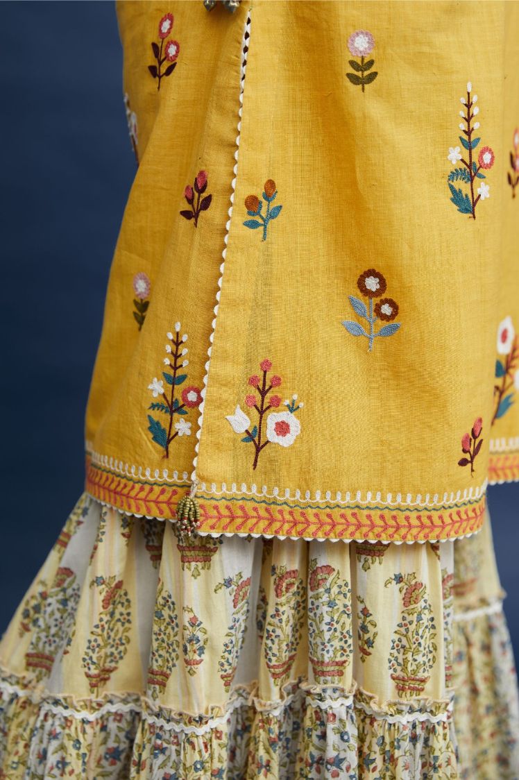 Short kurta set with all-over multi colored jaal embroidery, highlighted with ric-rac.