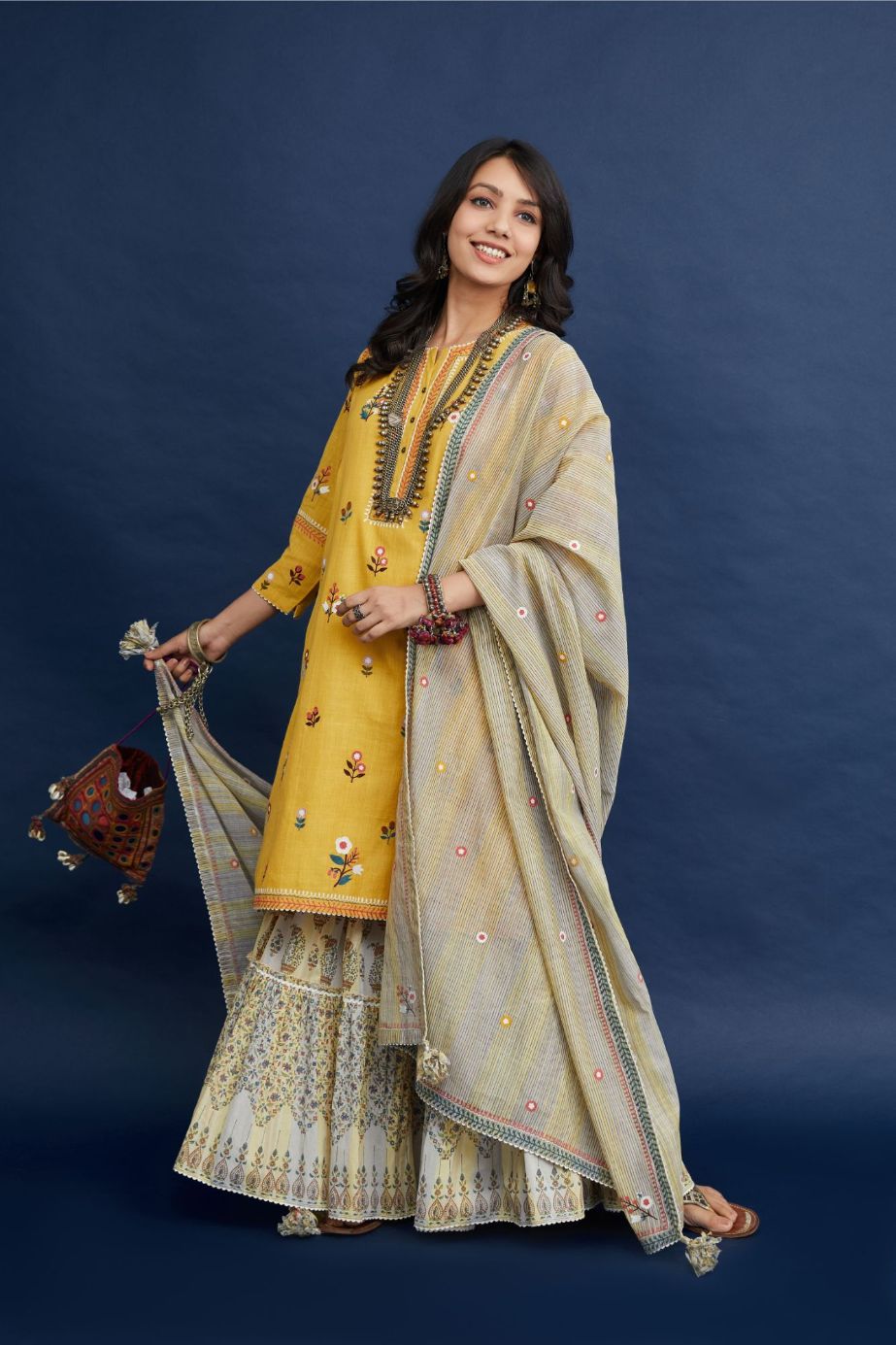 Short kurta set with all-over multi colored jaal embroidery, highlighted with ric-rac.