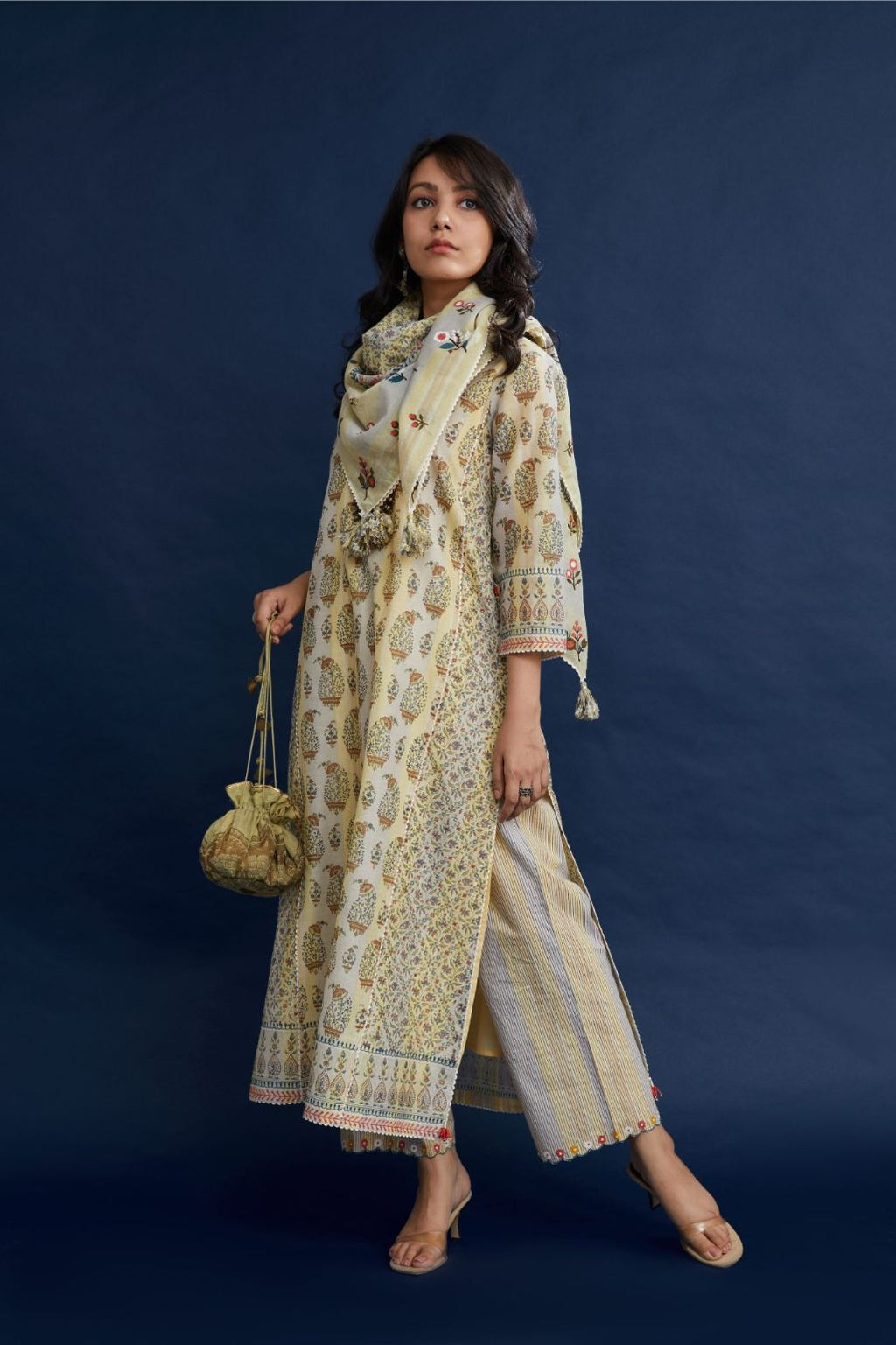 Hand block printed silk chanderi kurta set with rickrack and beaded tassels detail .