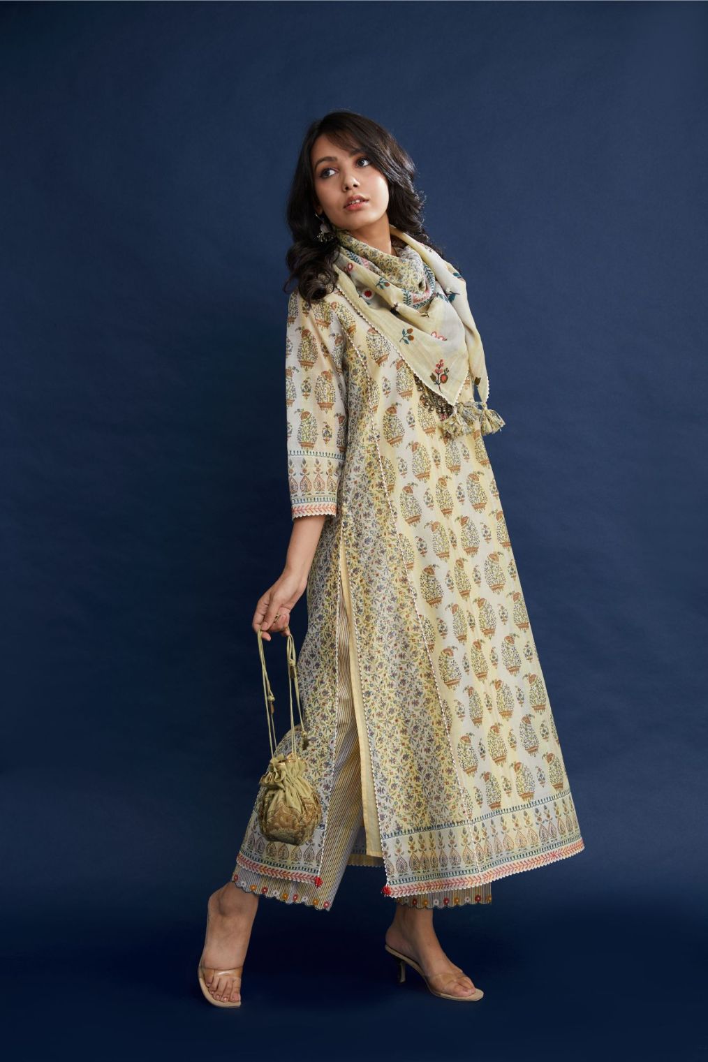 Hand block printed silk chanderi kurta set with rickrack and beaded tassels detail .