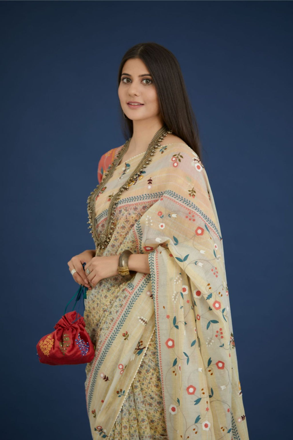 Beige hand block printed cotton Chanderi saree with all-over multi colored thread embroidery and fabric tassels (Saree+Peticot)