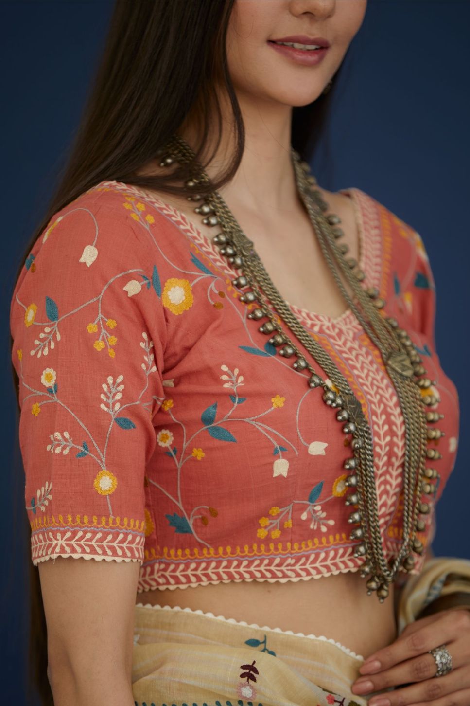 Brick red princess cut blouse with all-over multi colored thread embroidery, with ric-rac detail.(Blouse)