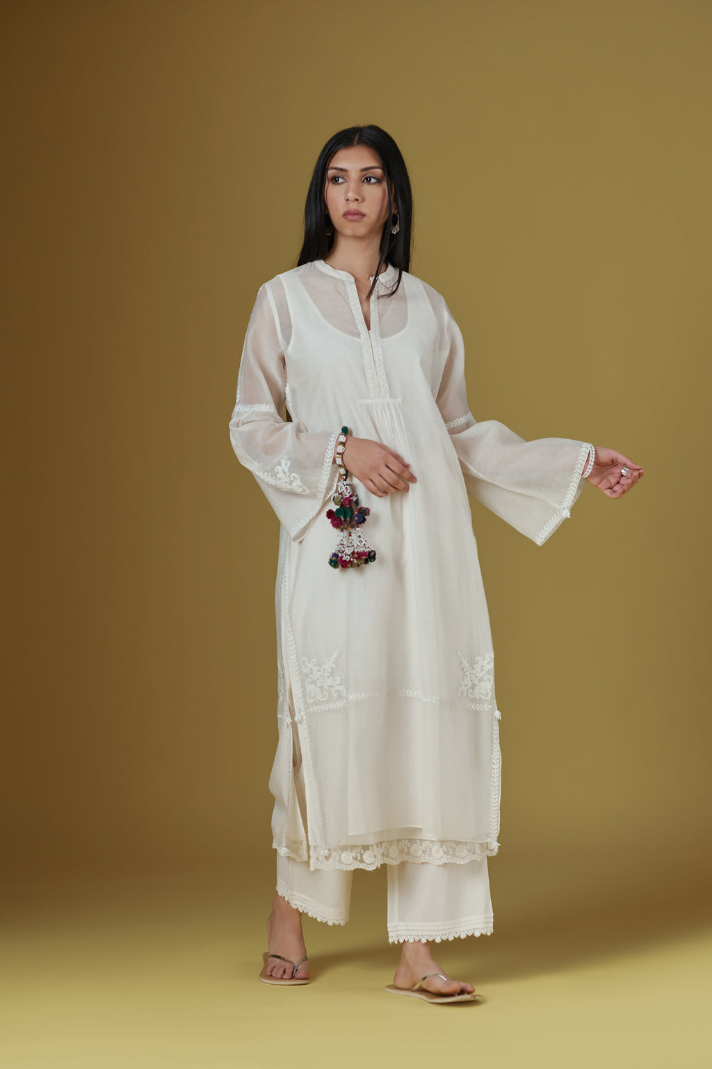 Off white straight kurta set highlighted with dori embroidery