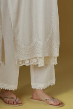 Straight kurta with dori embroidered raised ‘V’ neckline with delicate tassels.